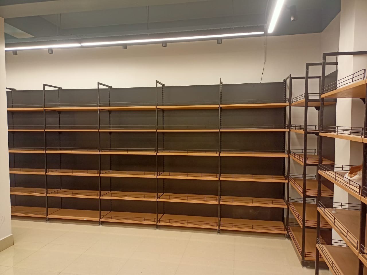Grocery shelving arranged for packaged goods.