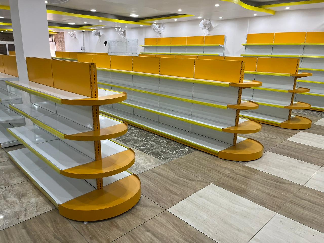 Retail display shelving arranged across a shop floor.