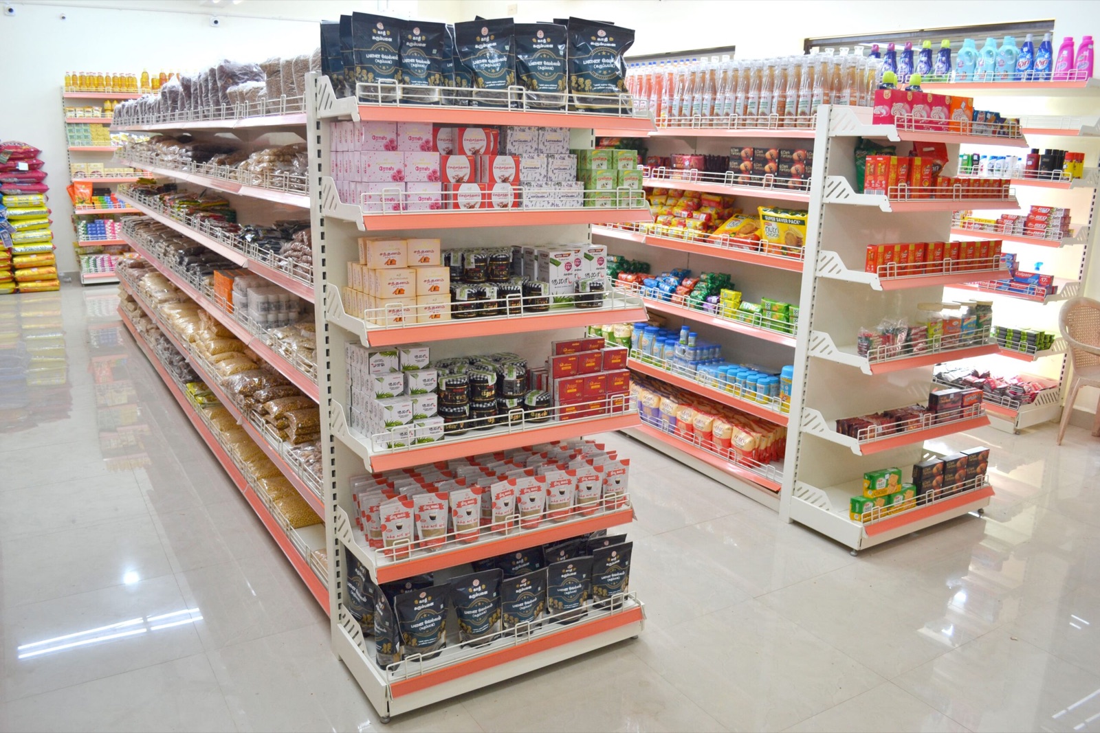 Retail shelves arranged in a stocked supermarket aisle.